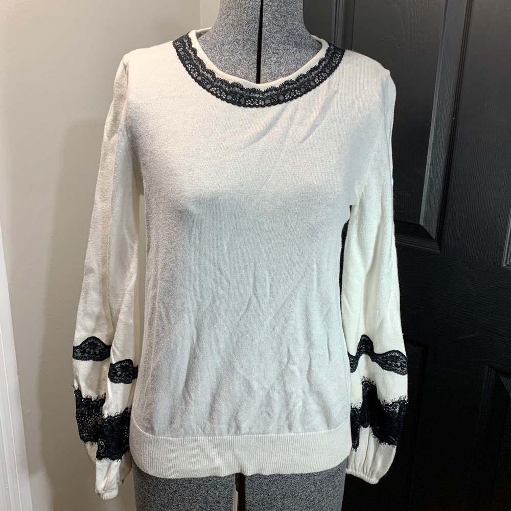 Sweater with lace accent and bell sleeve